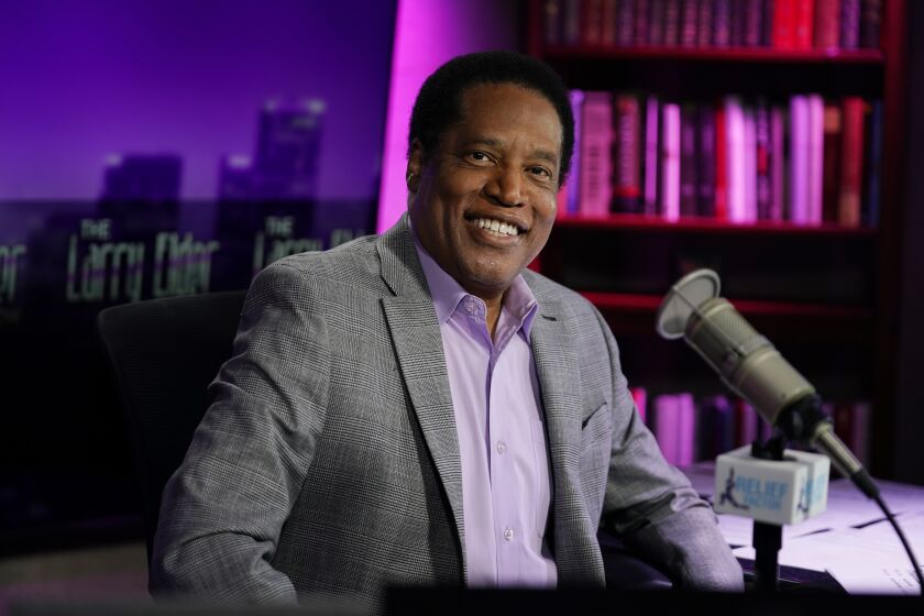 Radio talk show host Larry Elder poses for a photo in his studio, Monday, July 12, 2021, in Burbank, Calif. Elder has announced he is running for governor of California. (AP Photo/Marcio Jose Sanchez)