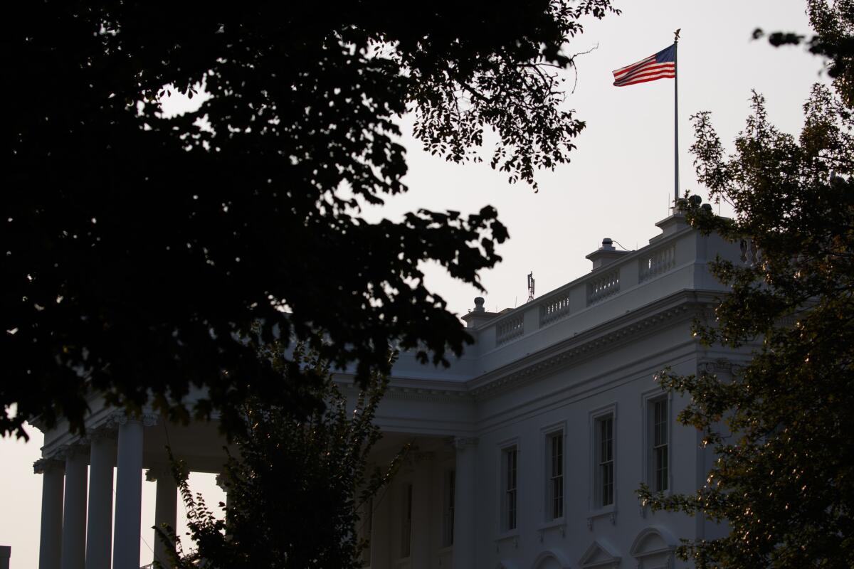 An American flag above the White House flies at full-staff on Monday.