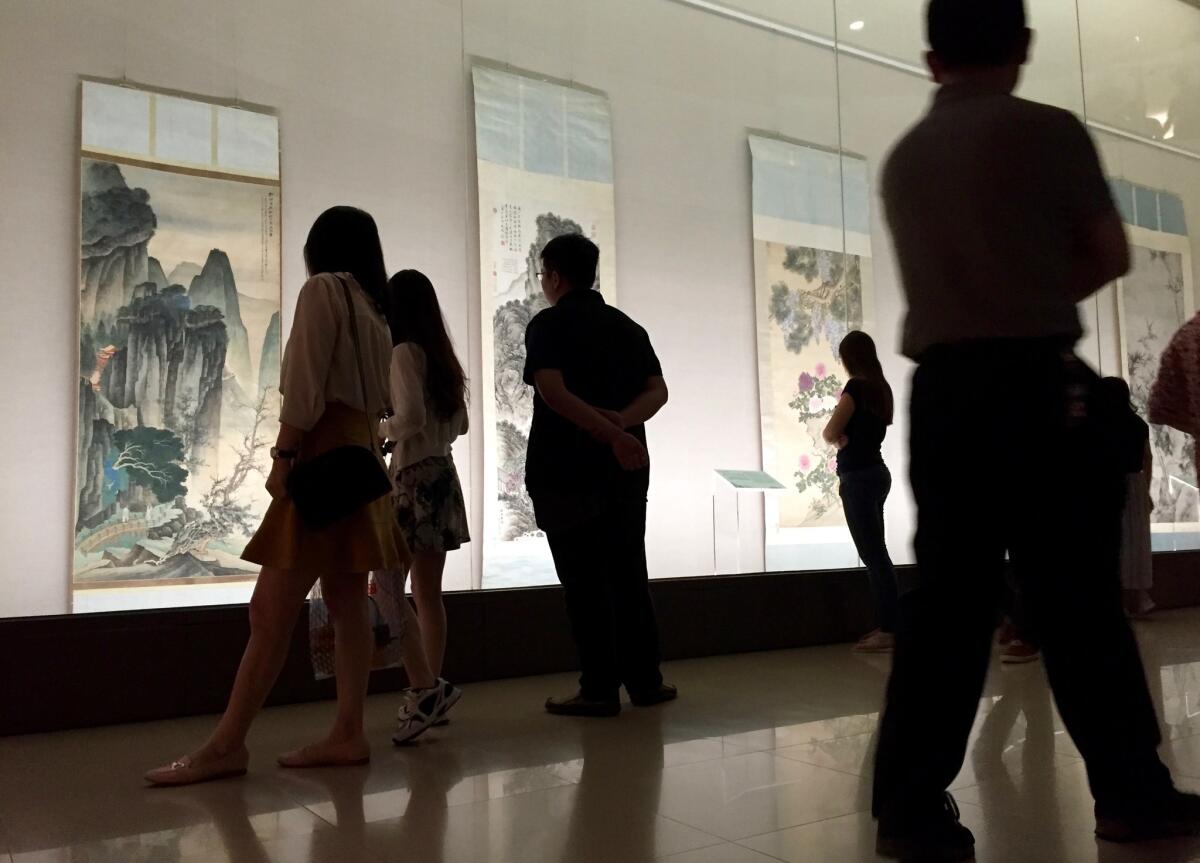 Museums and parks across Taiwan saw fewer mainland visitors during China's National Day holiday. Each government blamed the other for the decline.