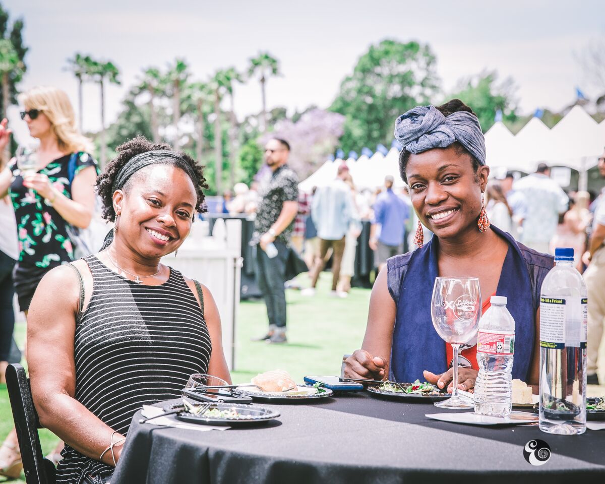 Visitors enjoy food and wine samples at a past California Wine Festival.