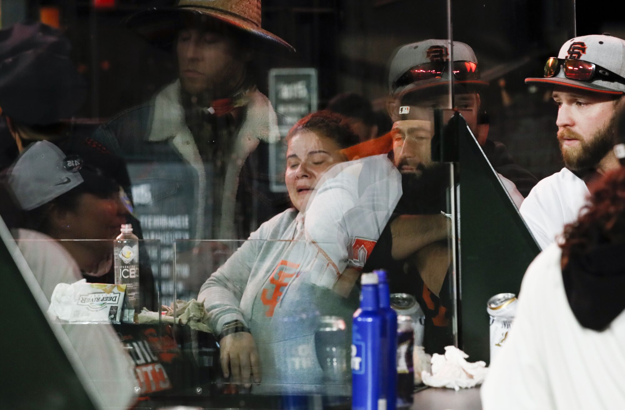 San Francisco Giants fans watch as the Los Angeles Dodgers celebrate after game five