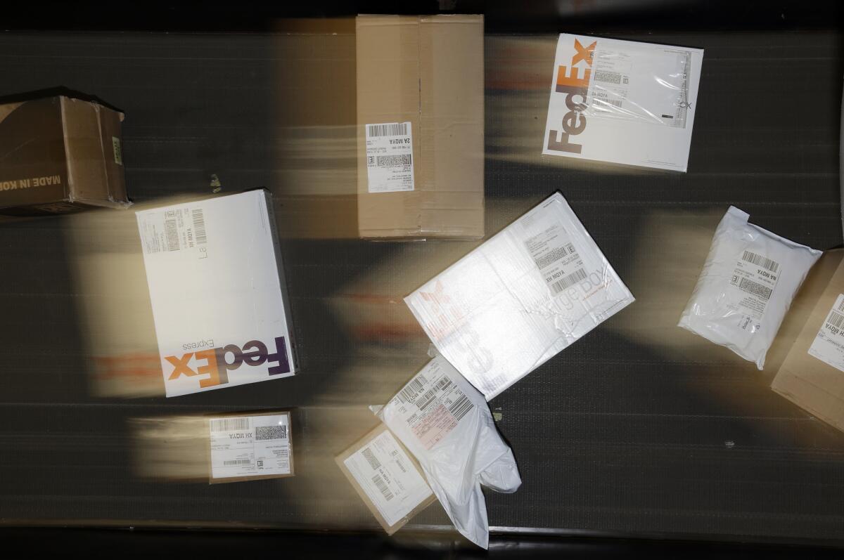 Packages are moved on a conveyor belt at a FedEx station. The company was indicted by a grand jury Thursday.