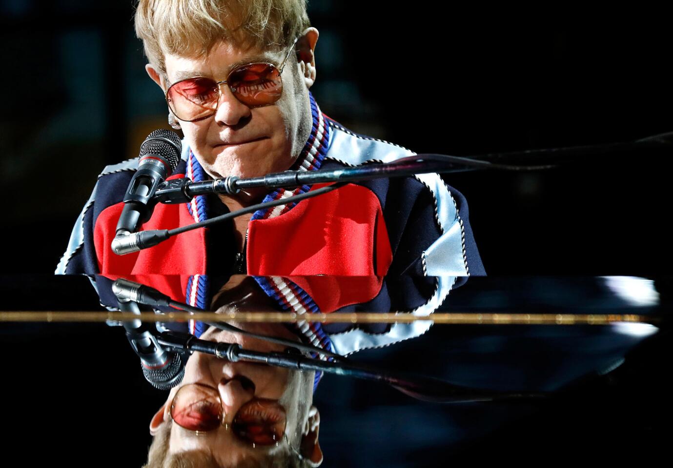 Elton John rehearses for the 60th Grammy Awards show at Madison Square Garden in New York on Jan. 25. Note the keyboard eyelashes.
