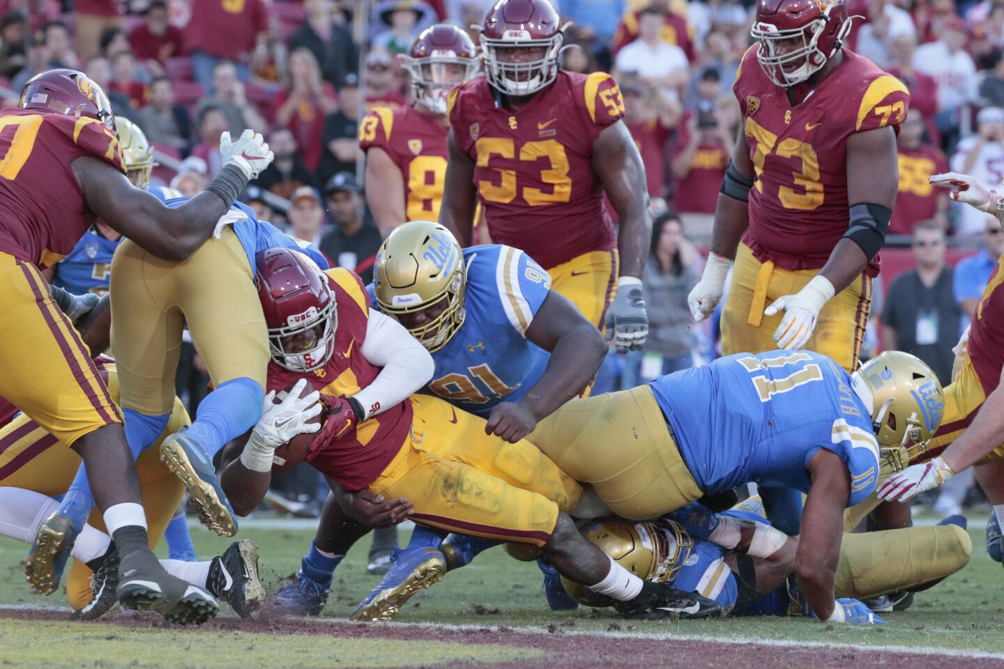 USC running back Stephen Carr (7) scores a touchdown on a short run late in the fourth quarter against UCLA at the Coliseum on Saturday.