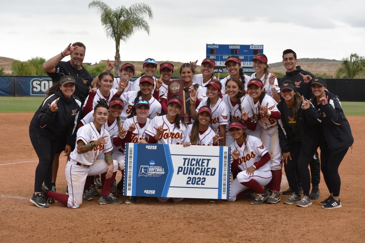 The Cal State Dominguez Hills softball team celebrates after winning the NCAA Division II West Region title.