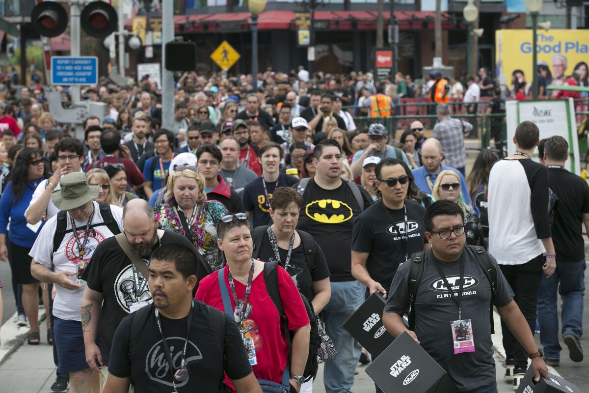 Crowds of fans pour across Harbor Drive on Day 2 of Comic-Con 2018 in San Diego.