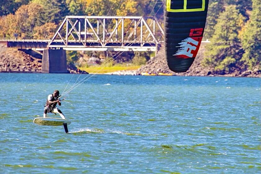 Felix Louis Syl N'jai kiteboards on Oregon's Columbia River Gorge.