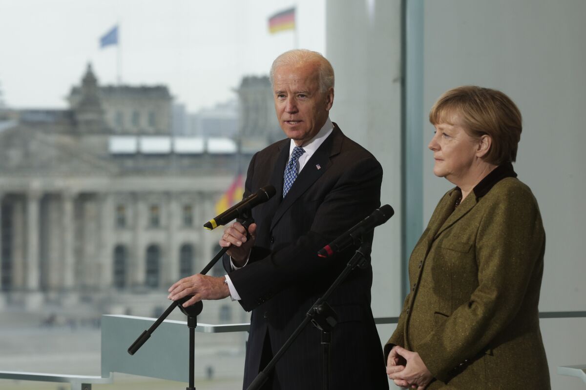 Joe Biden, as vice president, addresses the media with German Chancellor Angela Merkel during a 2013 trip to Berlin.