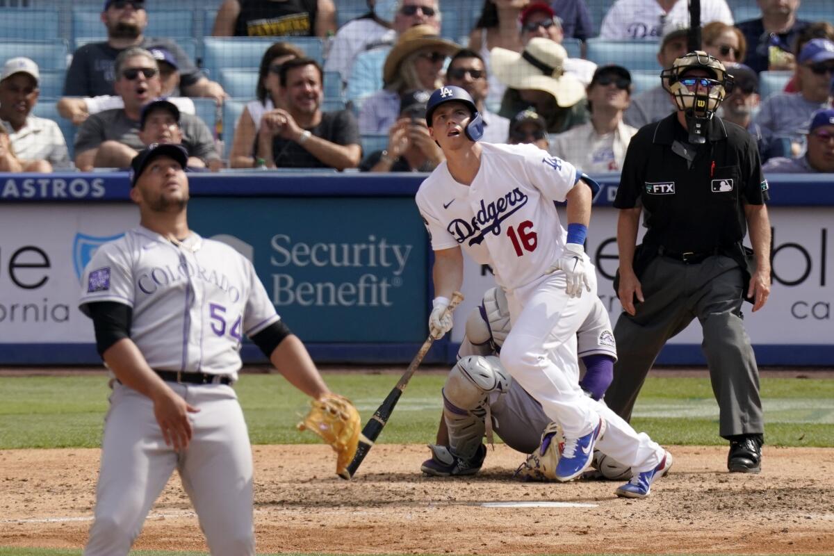 The Dodgers' Will Smith watches the flight of his home run as he leaves the batter's box.