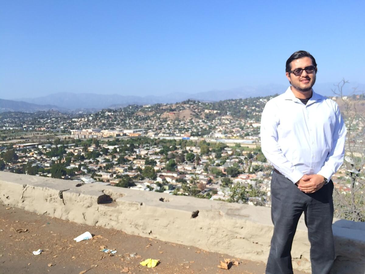 Daniel Paredes with his neighborhood Frogtown in the distance.