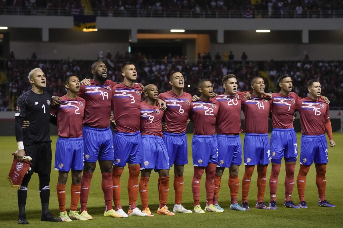 FILE - Costa Rica's players sing the national anthem prior to a qualifying soccer match against the United States for the FIFA World Cup Qatar 2022 in San Jose, Costa Rica, Wednesday, March 30, 2022. The Central American team will play New Zealand on June 14, 2022, for a last chance to make it to the World Cup. (AP Photo/Moises Castillo, File)
