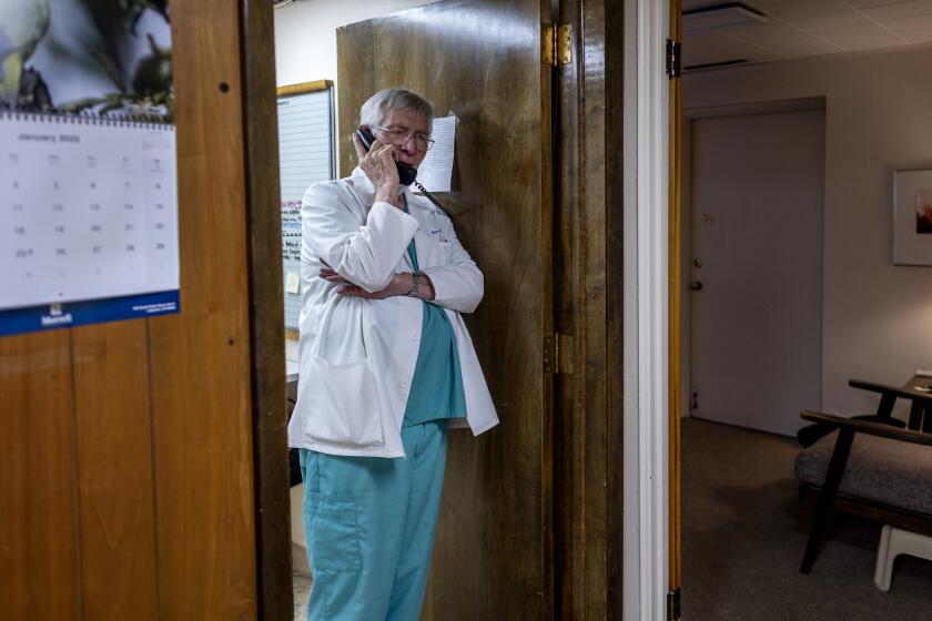 BOULDER, CO - JANUARY 31, 2022: Dr Warren Hern talk on the phone in his clinic on January 31, 2022 in Boulder, Colorado. He has been performing abortions since the 1970's. He is known for doing late-term abortions because of fetal anomalies.(Gina Ferazzi / Los Angeles Times)