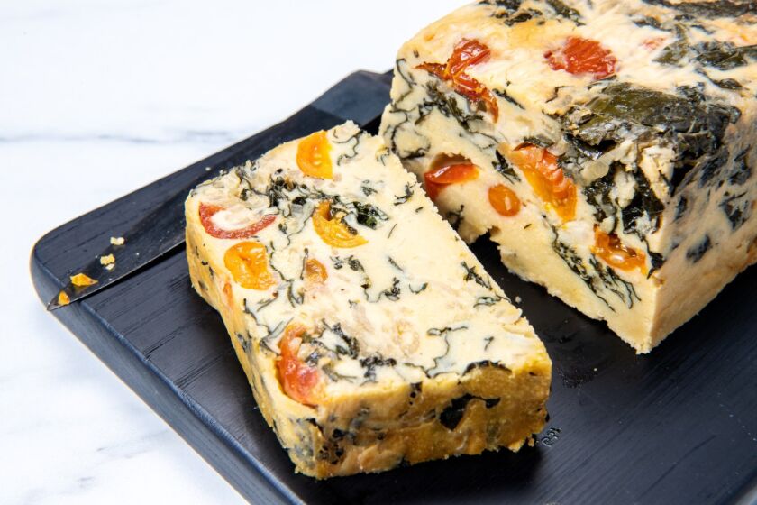 A mosaic of kale and tomatoes lace this chickpea frittata.