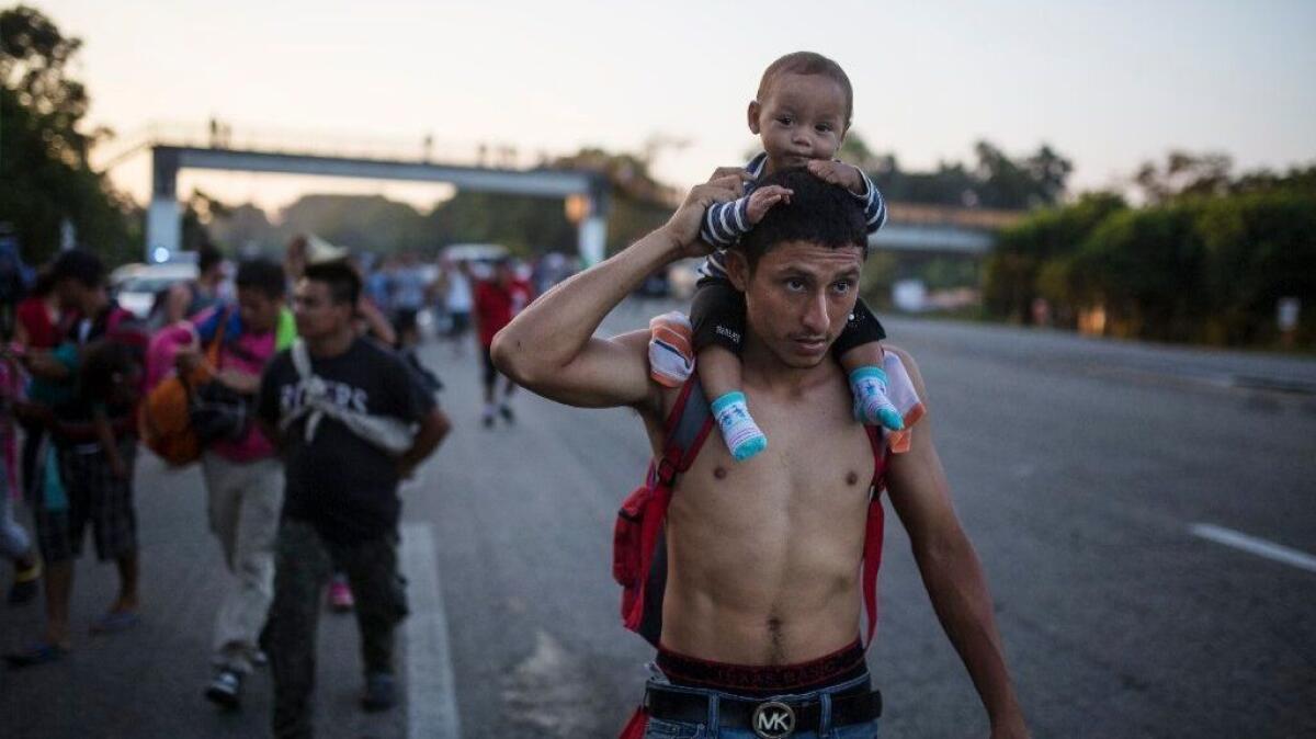 Central American migrants traveling with a caravan to the U.S. make their way to Mapastepec, Mexico, on Oct. 24.