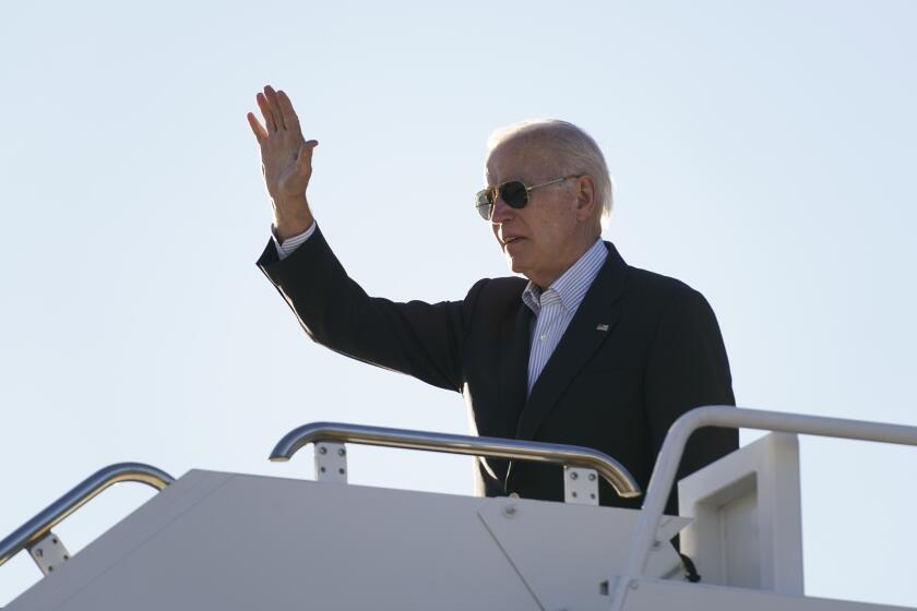 President Joe Biden waves before boarding Air Force One at El Paso International Airport in El Paso, Texas, Sunday, Jan. 8, 2023, to travel to Mexico City, Mexico. (AP Photo/Andrew Harnik)