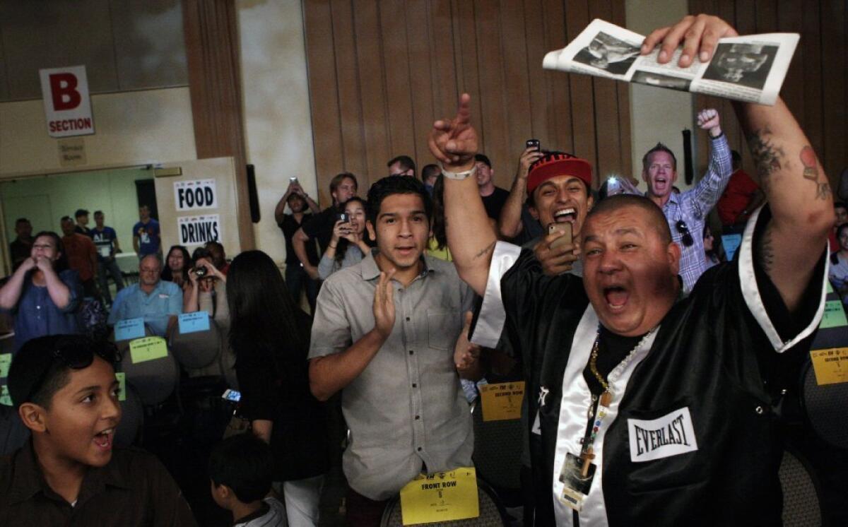 Boxing fans cheer during the action at Glendale Glory 4 at the Glendale Civic Auditorium.