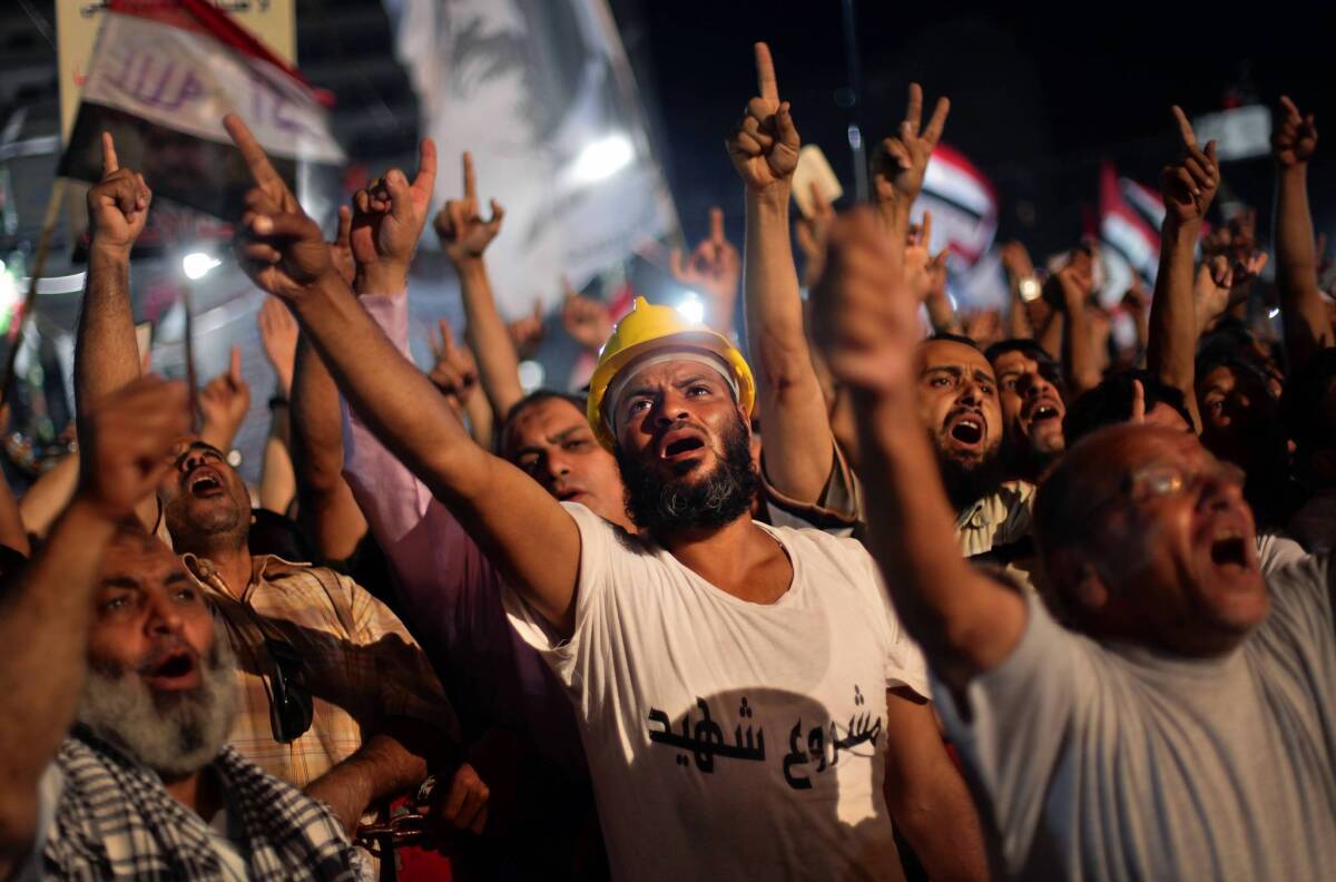 Supporters of ousted President Mohamed Morsi demonstrate outside Cairo's Rabaa al Adawiya mosque, one of the focuses of Islamist protests in Egypt. The government has announced plans to break up protests.