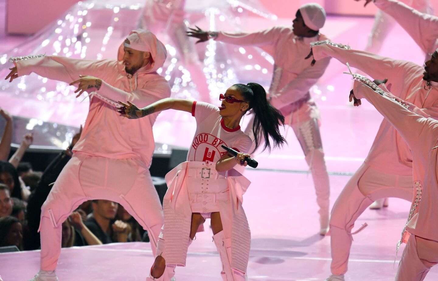 Rihanna and a stage full of dancers perform in one of her many sets during the night.