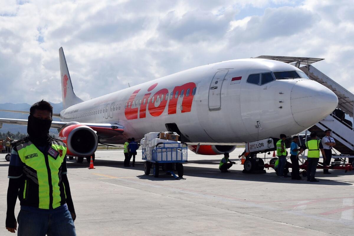 In this file photo taken on Oct. 10, 2018, a Lion Air Boeing 737 Max 800 aircraft is seen at the tarmac of the Mutiara Sis Al Jufri airport in Palu, Indonesia.