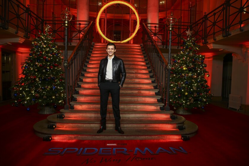 Tom Holland poses for photographers at the photo call for the film 'Spider-Man: No Way Home' in London Sunday, Dec. 5, 2021. (Photo by Joel C Ryan/Invision/AP)