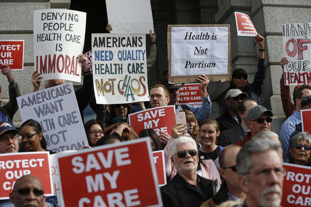 Supporters of the Affordable Care Act gather for a rally on the state Capitol steps in Denver, Colorado on Jan. 31, 2017.