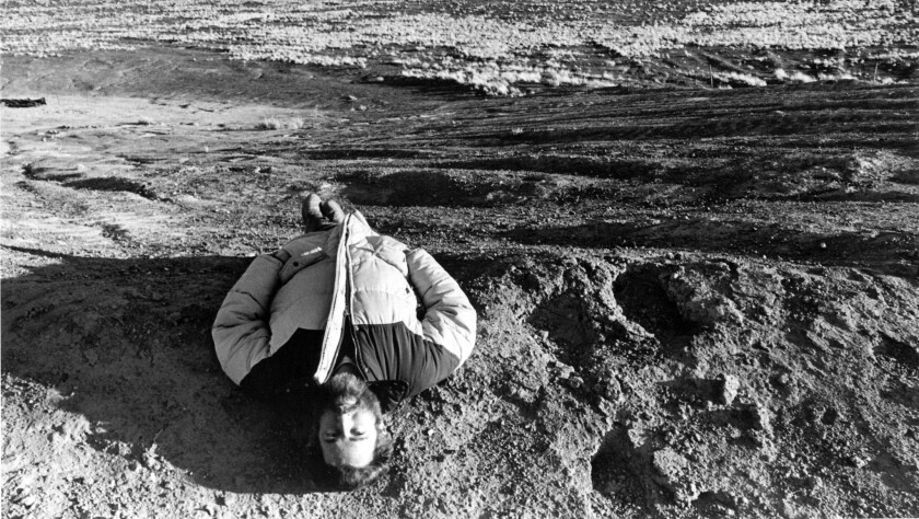 James Turrell lies near the center of his "Roden Crater" in 1984.