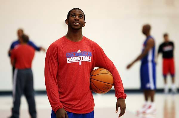 Chris Paul was on hand for Clippers practice in Playa Vista on Saturday morning but was not allowed to do much more than "just watch and wish," he said, until his trade to the team was finalized by the NBA.