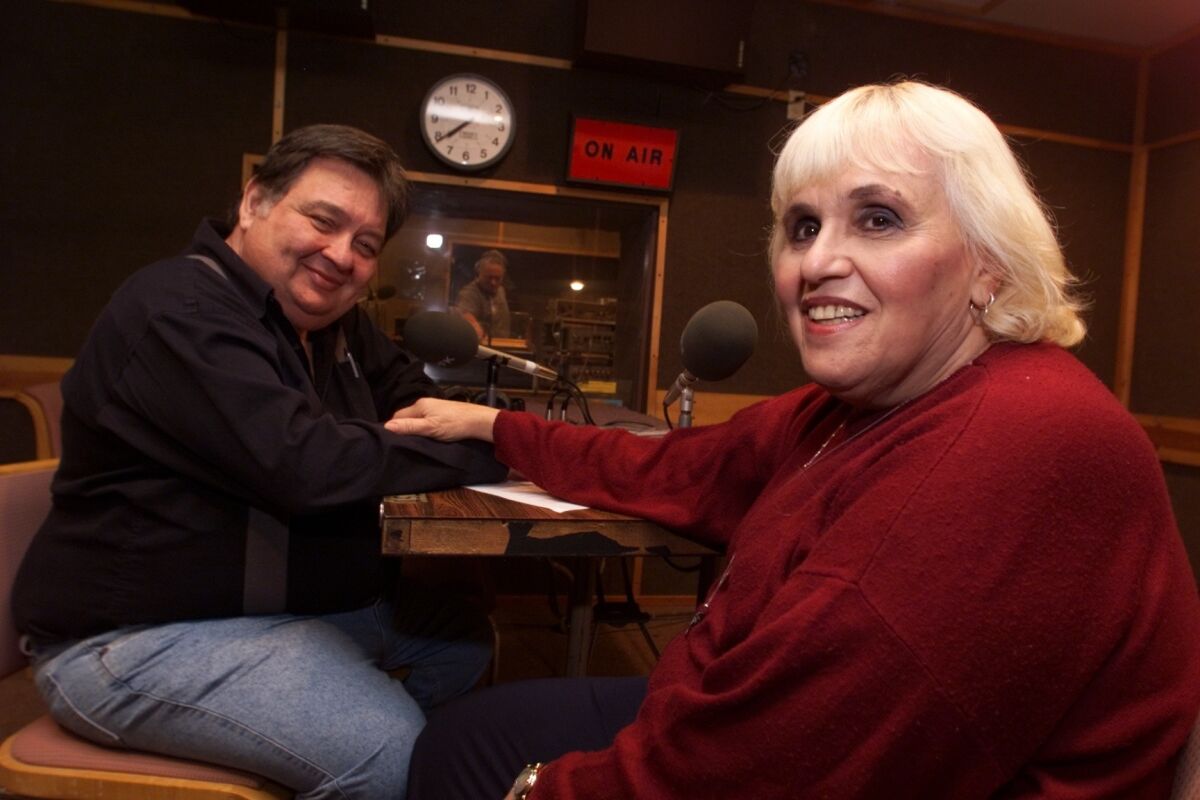 Howard and Roz Larman in the studio in 1999 at their long-running radio show "FolkScene," which has promoted folk music on the L.A. radio dial for 46 years.