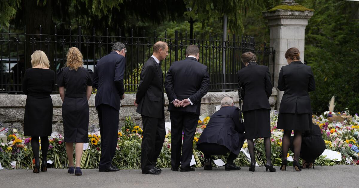 Members of the British Royal family view the floral tributes to Queen Elizabeth II.