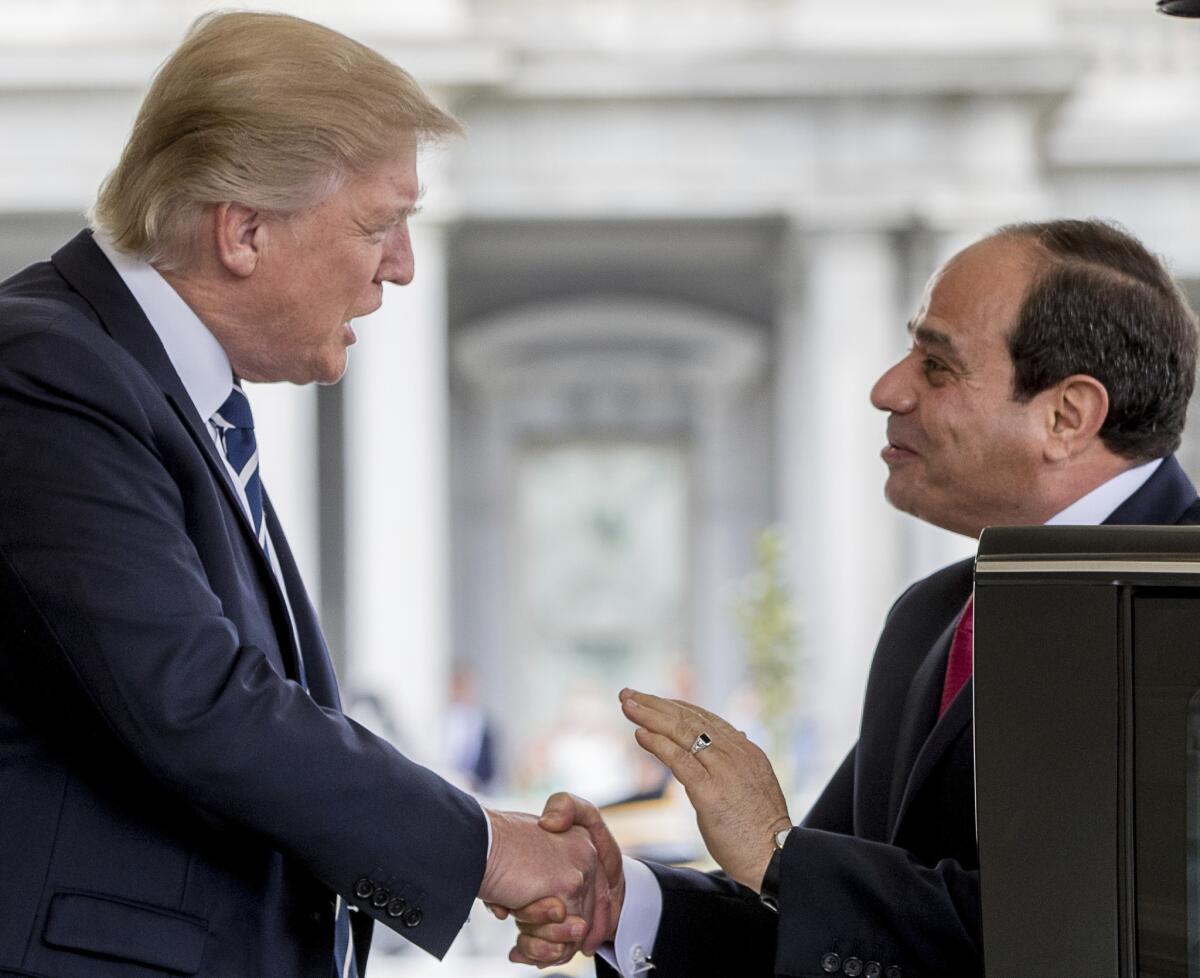 President Donald Trump greets Egyptian President Abdel-Fattah el-Sisi as he arrives at the White House in Washington on April 3, 2017.