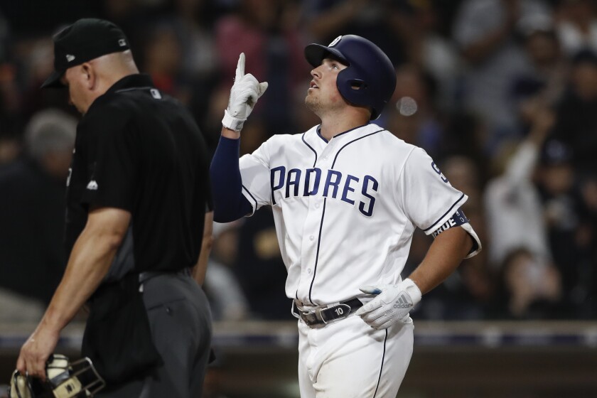 Padres outfielder Hunter Renfroe gestures crosses the plate after hitting his 25th home run of the season Wednesday against the Giants.