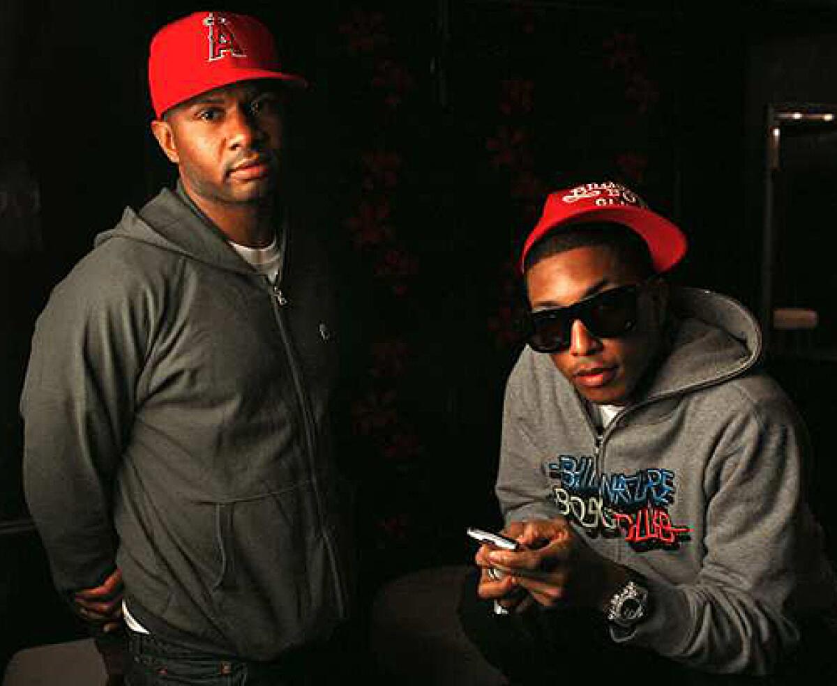 Sheldon "Shay" Haley, left, and Pharrell Williams, right, team in N.E.R.D. with the M.I.A. Chad Hugo, who also records with Williams in the Neptunes. The side gig has become a big deal.