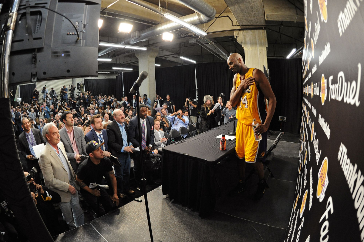 Kobe Bryant speaks to reporters after his final NBA game April 13, 2016