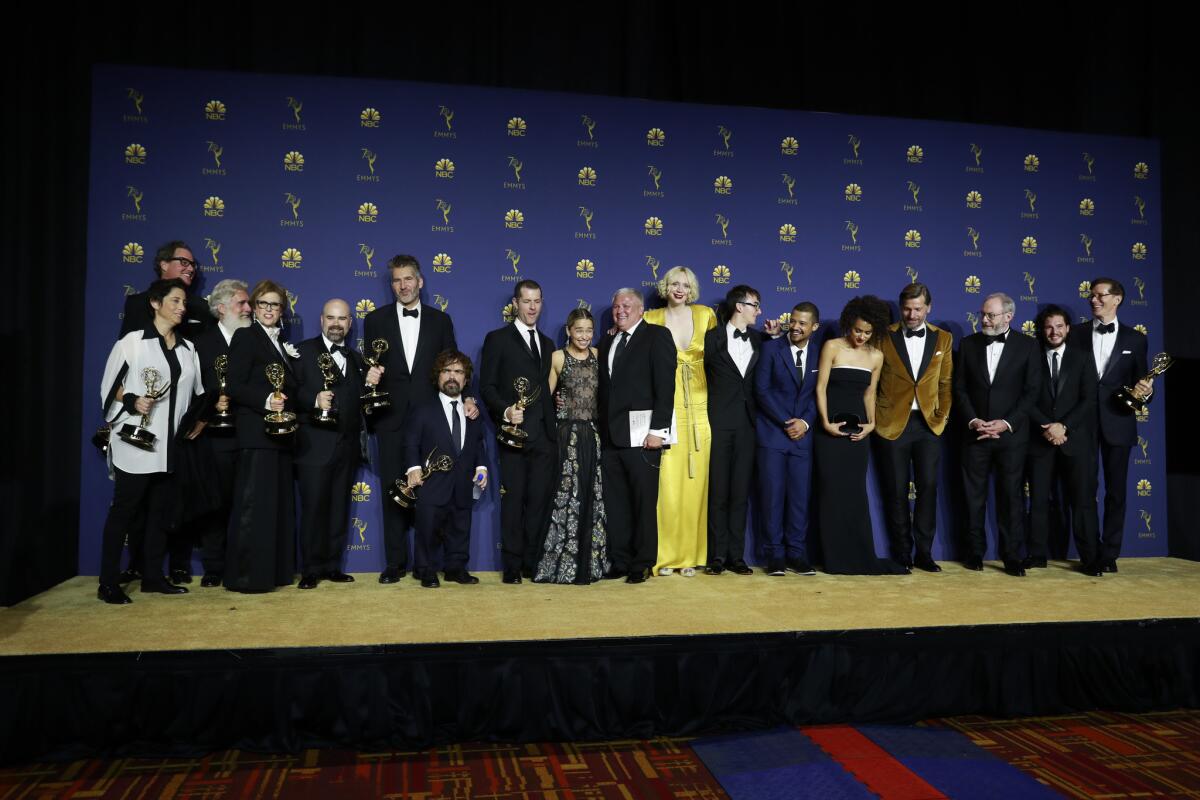 The cast and producers of "Game of Thrones" backstage after winning the drama series Emmy.