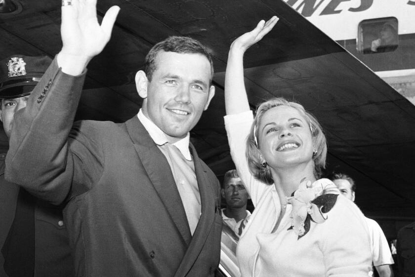 FILE - In this July 3, 1959 file photo, Swedish actress Bibi Andersson, right, and Sweden's Ingemar Johansson wave for the photographers at New York's Idlewild Airport. Swedens Film Institute says Bibi Andersson, the Swedish actress who played in films by fellow countryman filmmaker Ingmar Bergman, died on Sunday April 14, 2019. She was 83. (AP Photo/Hans von Nolde, File)