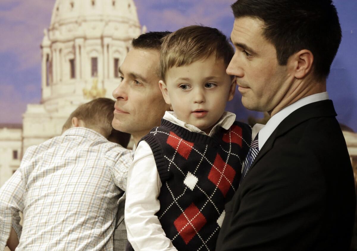 Dr. Paul Melchert, left, and his partner, James Zimerman, in St. Paul, Minn., where a bill to legalize gay marriage has been introduced.