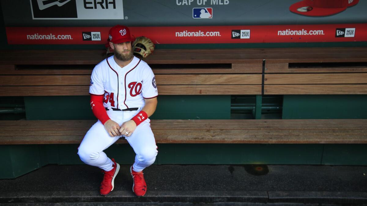 Washington Nationals right fielder Bryce Harper looks on from the bench during the Nationals' final home game of the 2018 season on Sept. 26.