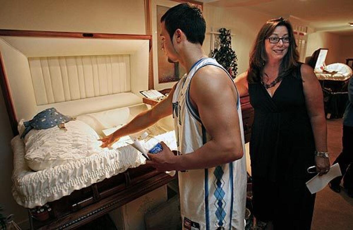 Roger Jasiak visits a New Jersey funeral home along with other students in the Kean University class Death in Perspective. With him is the professor, Norma Bowe, who has taught the popular class for a decade.
