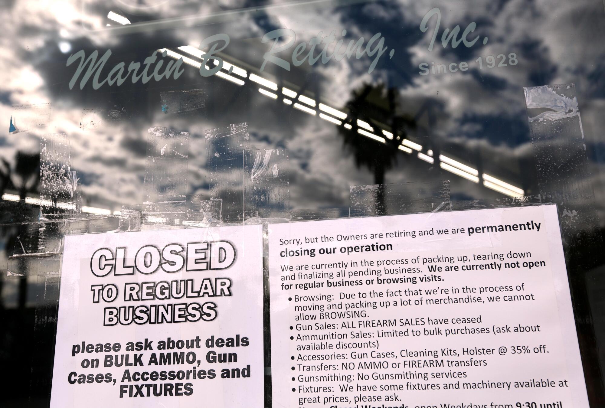 A notice on the front door of the Martin B. Retting Gun store.