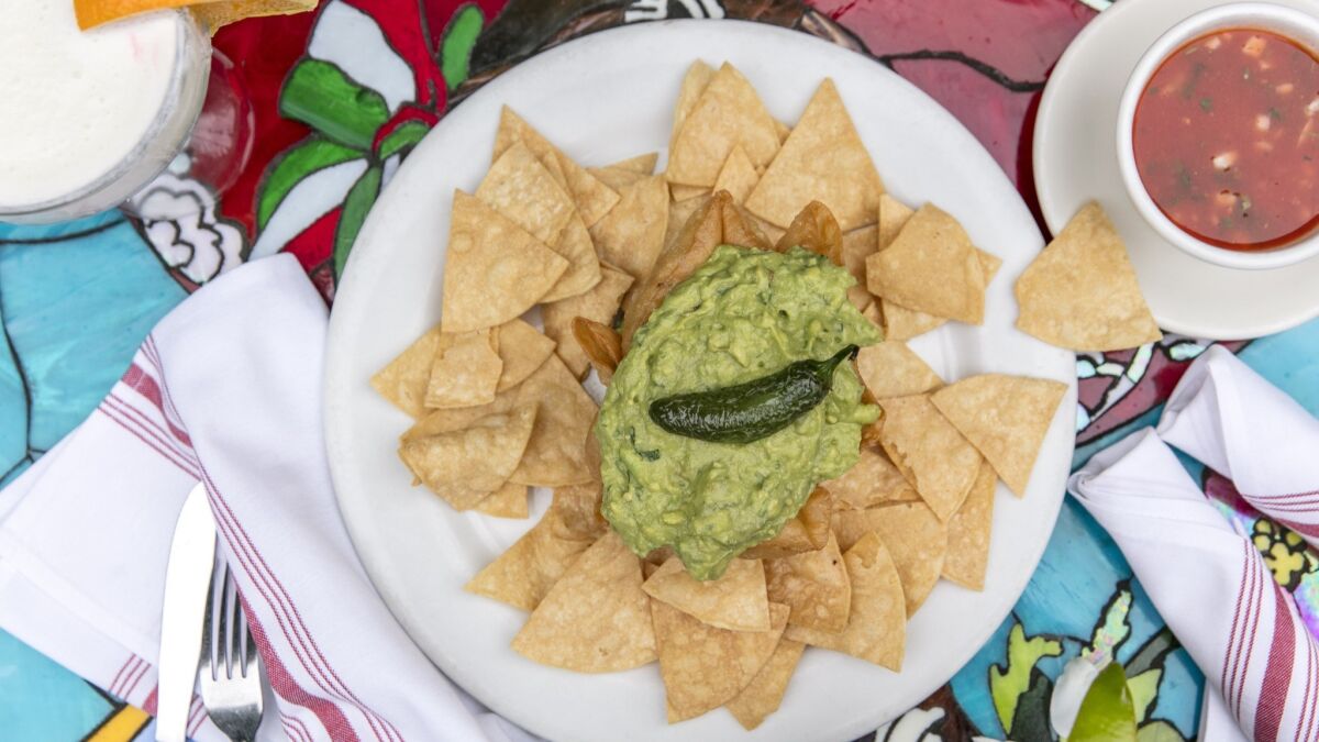 Fresh homemade guacamole, served in a crispy flour tortilla bowl, with hand-cut tortilla chips and a side of salsa, at Casita del Campo in Silver Lake.