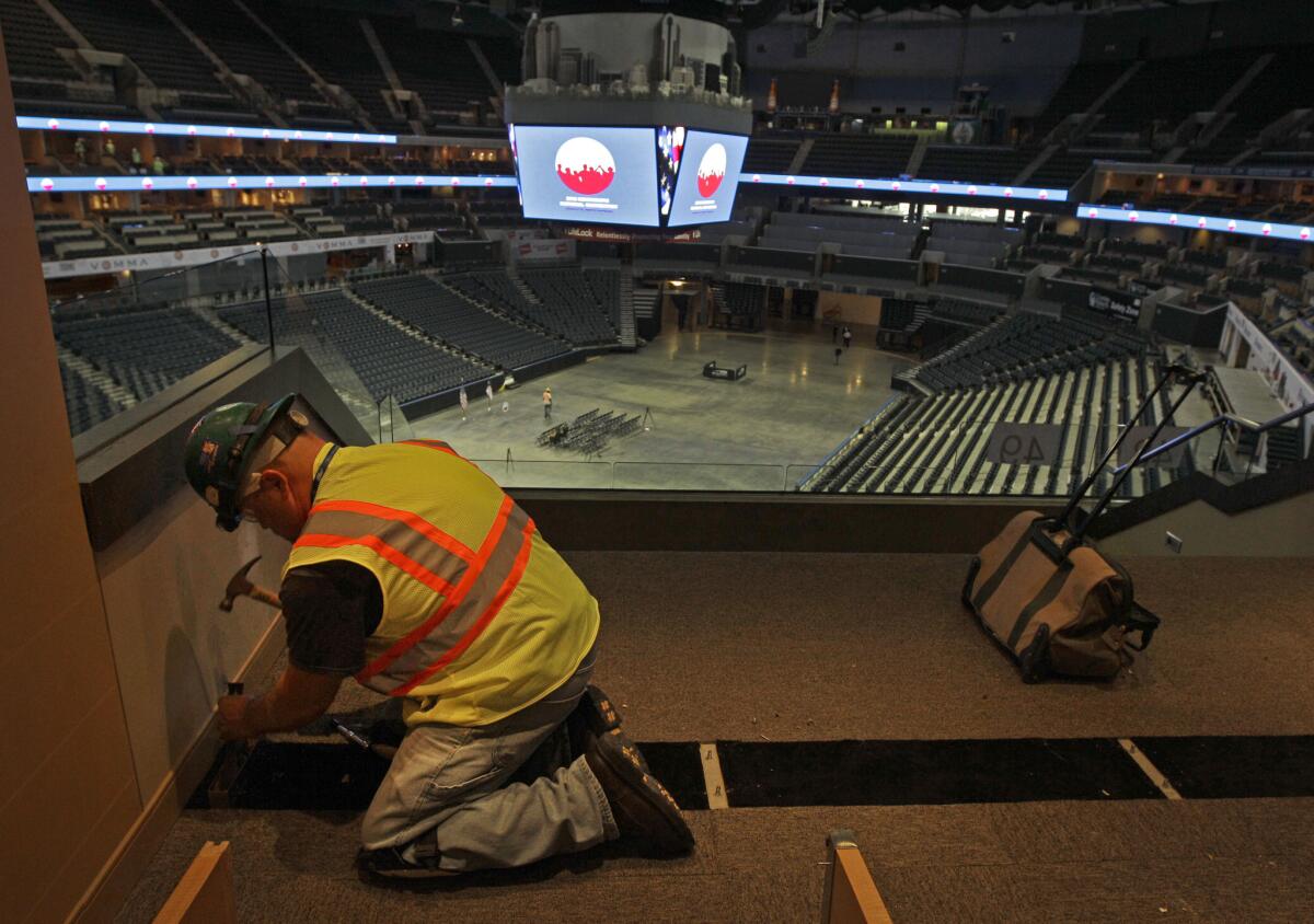 During preparations for the 2012 Democratic National Convention, construction worker Steve Law works on a luxury box at Time Warner Cable Arena in Charlotte, N.C., on July 16.