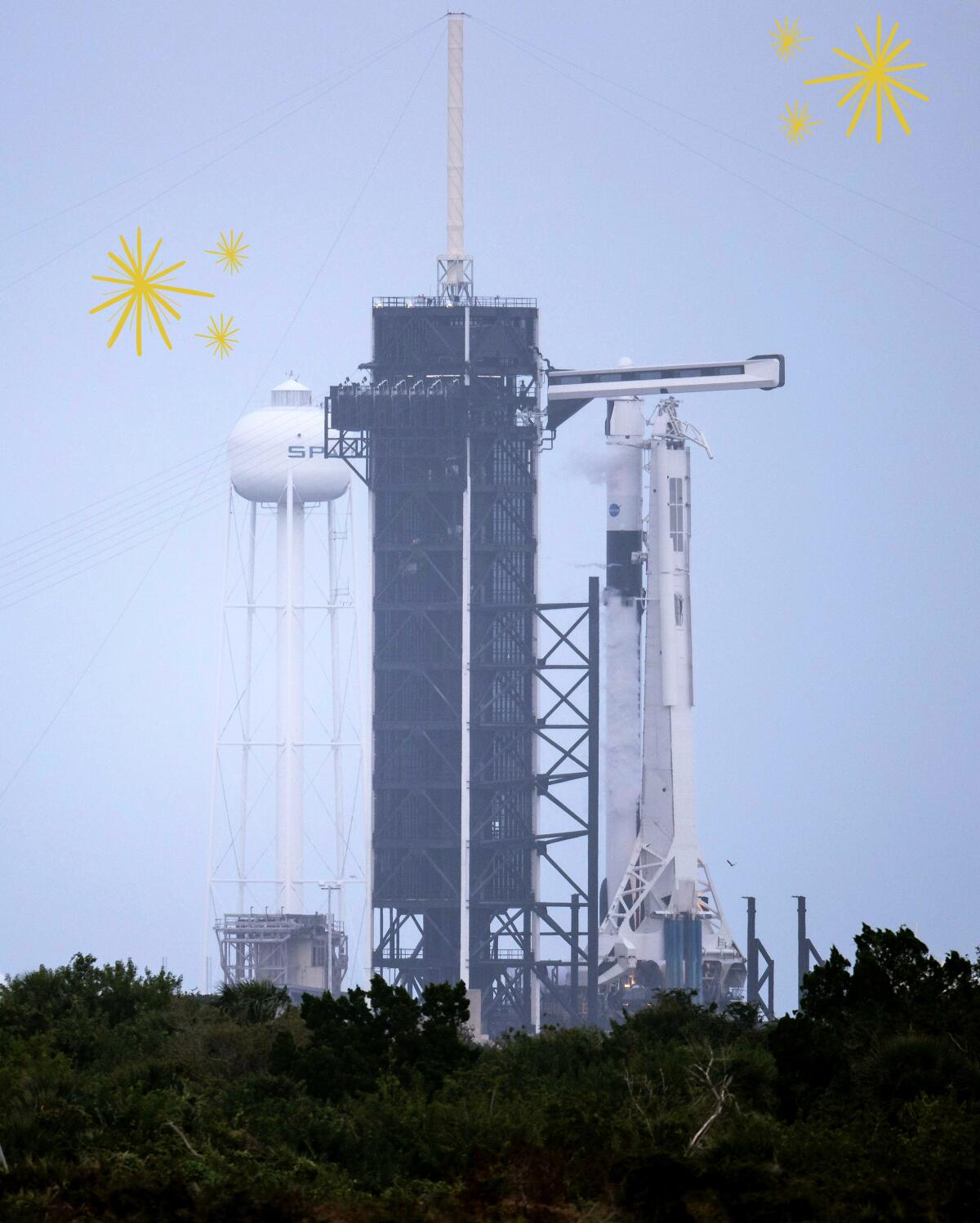 A SpaceX Falcon 9 rocket with the company's Crew Dragon capsule attached sits on the launch pad at the Kennedy Space Center