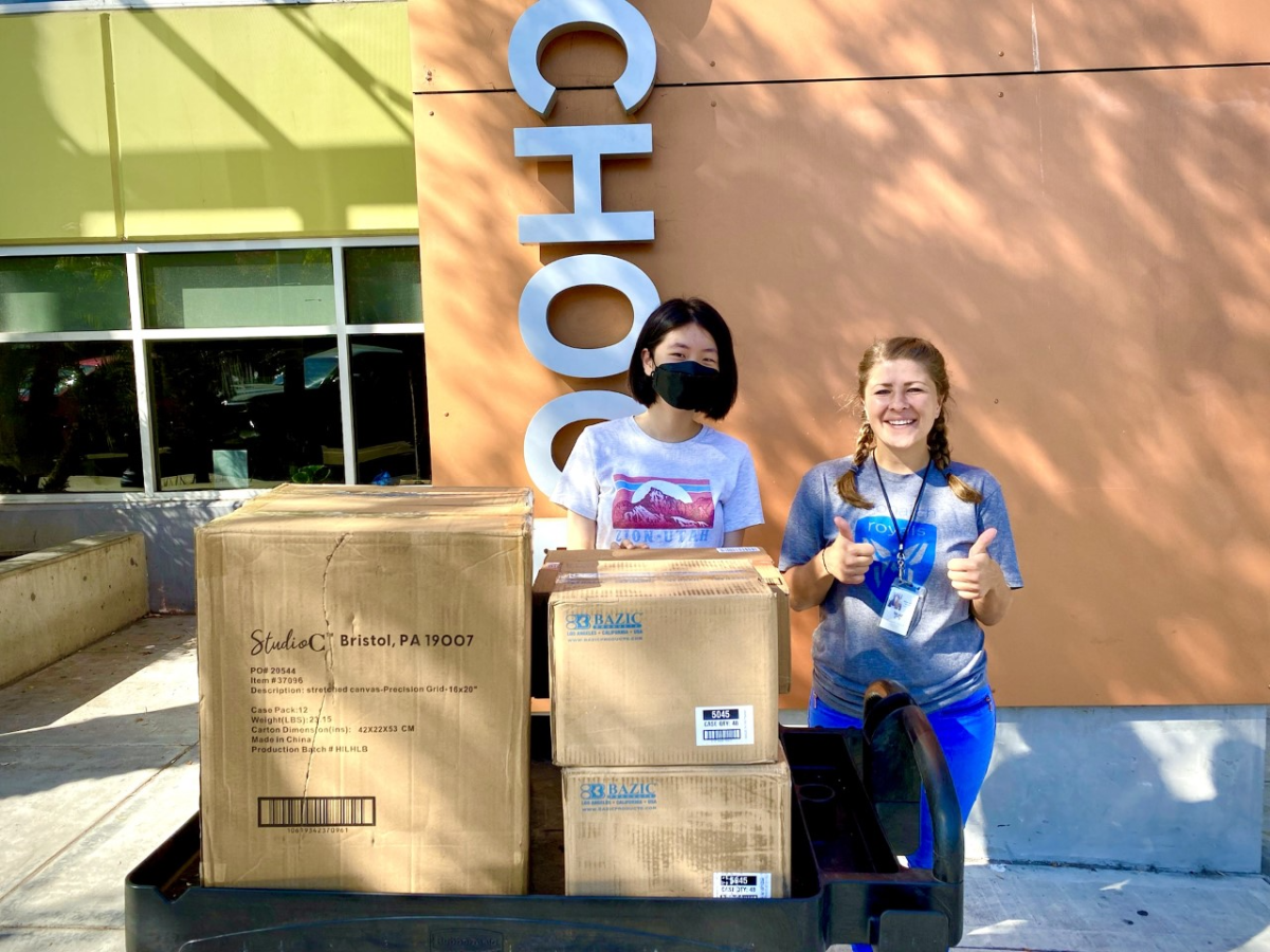 Kate Lee donates art supplies to Monarch School Donations Manager Sarah Krueger