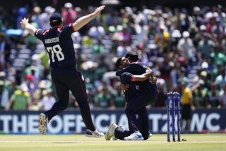 Saurabh Nethralvakar celebrates with U.S. teammates after beating Pakistan during a T20 World Cup cricket match