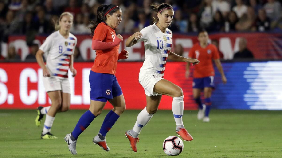 United States' Alex Morgan, right, during the first half of an international friendly soccer match against Chile on Aug. 31 in Carson.