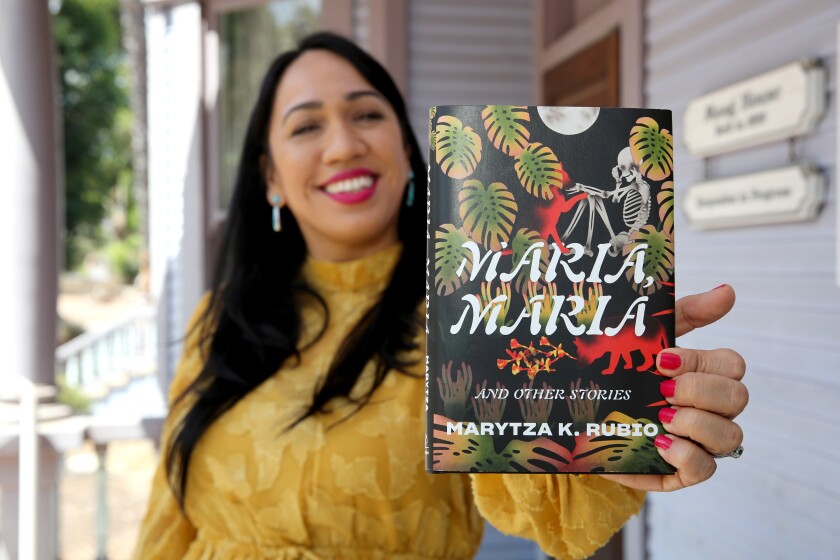 Santa Ana resident Marytza K. Rubio holds her book, "Maria, Maria and Other Stories."