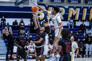 Alex Dupre of Birmingham with a block against Chatsworth earlier this season. He scored 45 points on Friday.