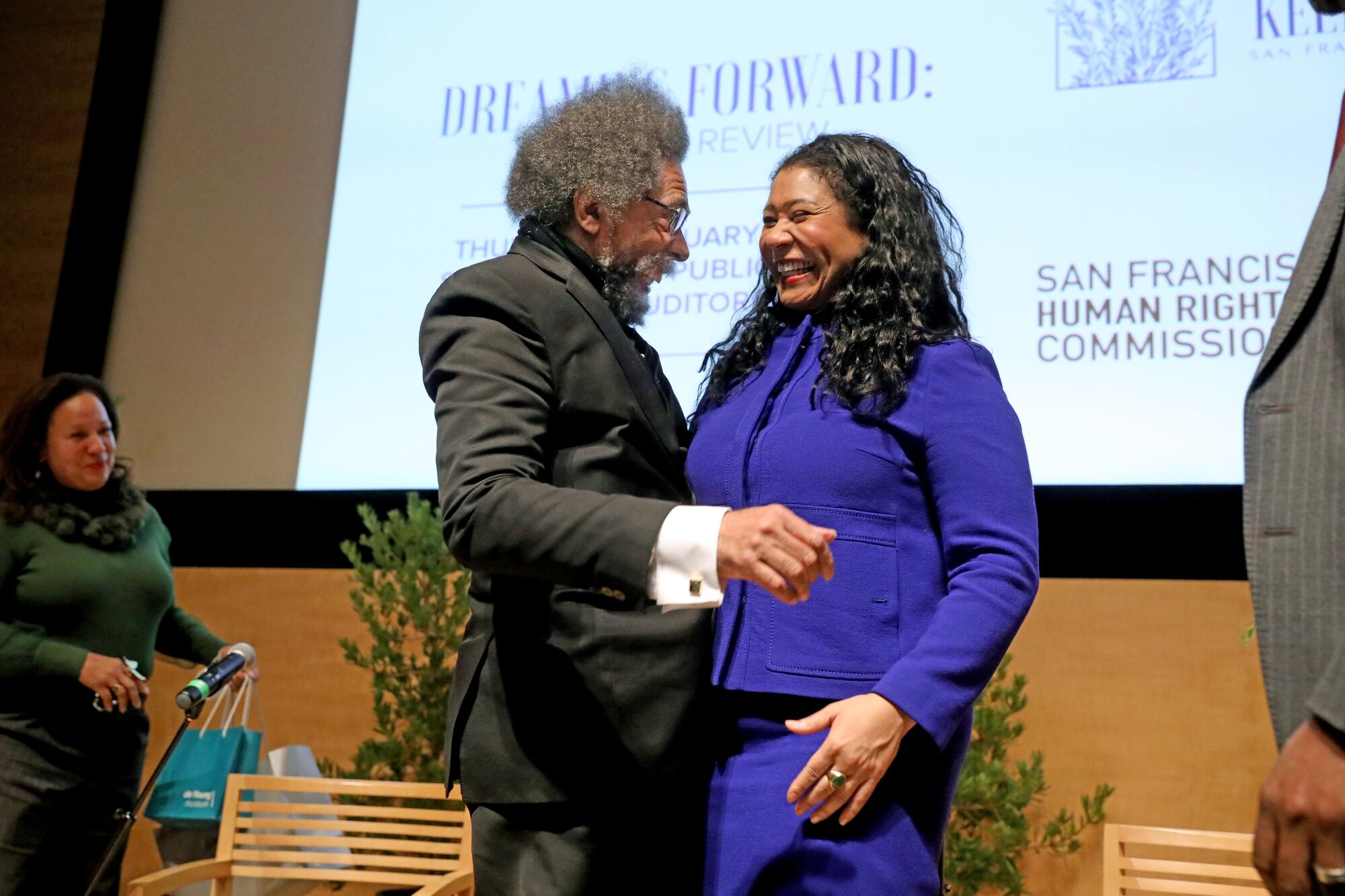 Cornel West, left, and London Breed.