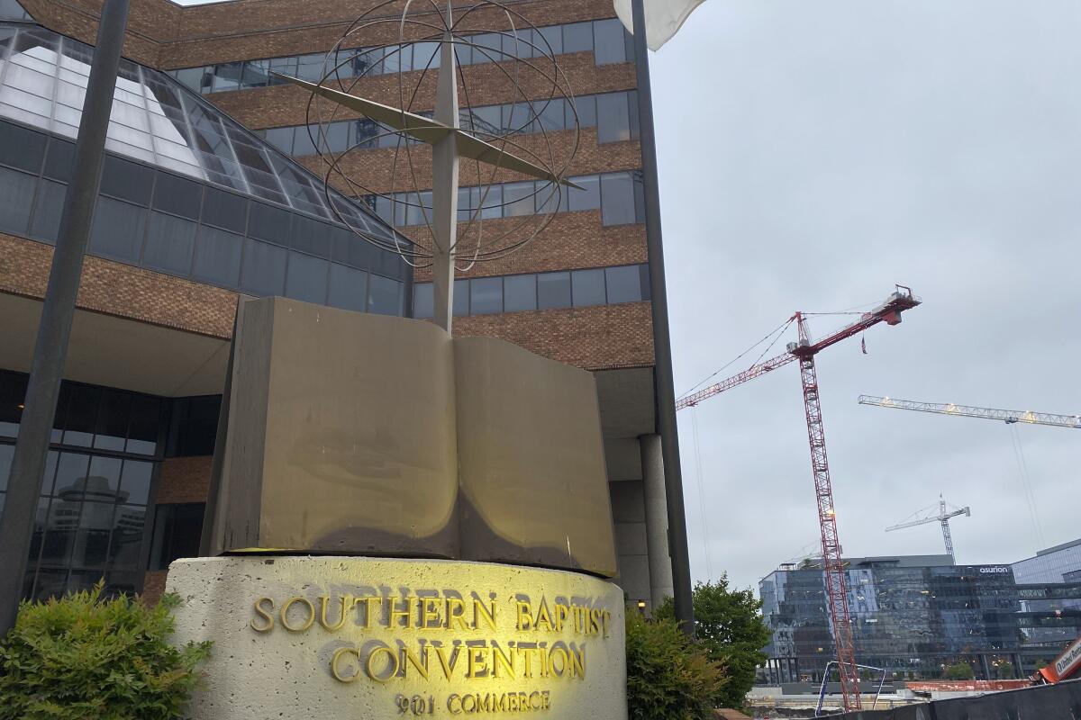 A cross and Bible sculpture stand outside the Southern Baptist Convention headquarters in Nashville