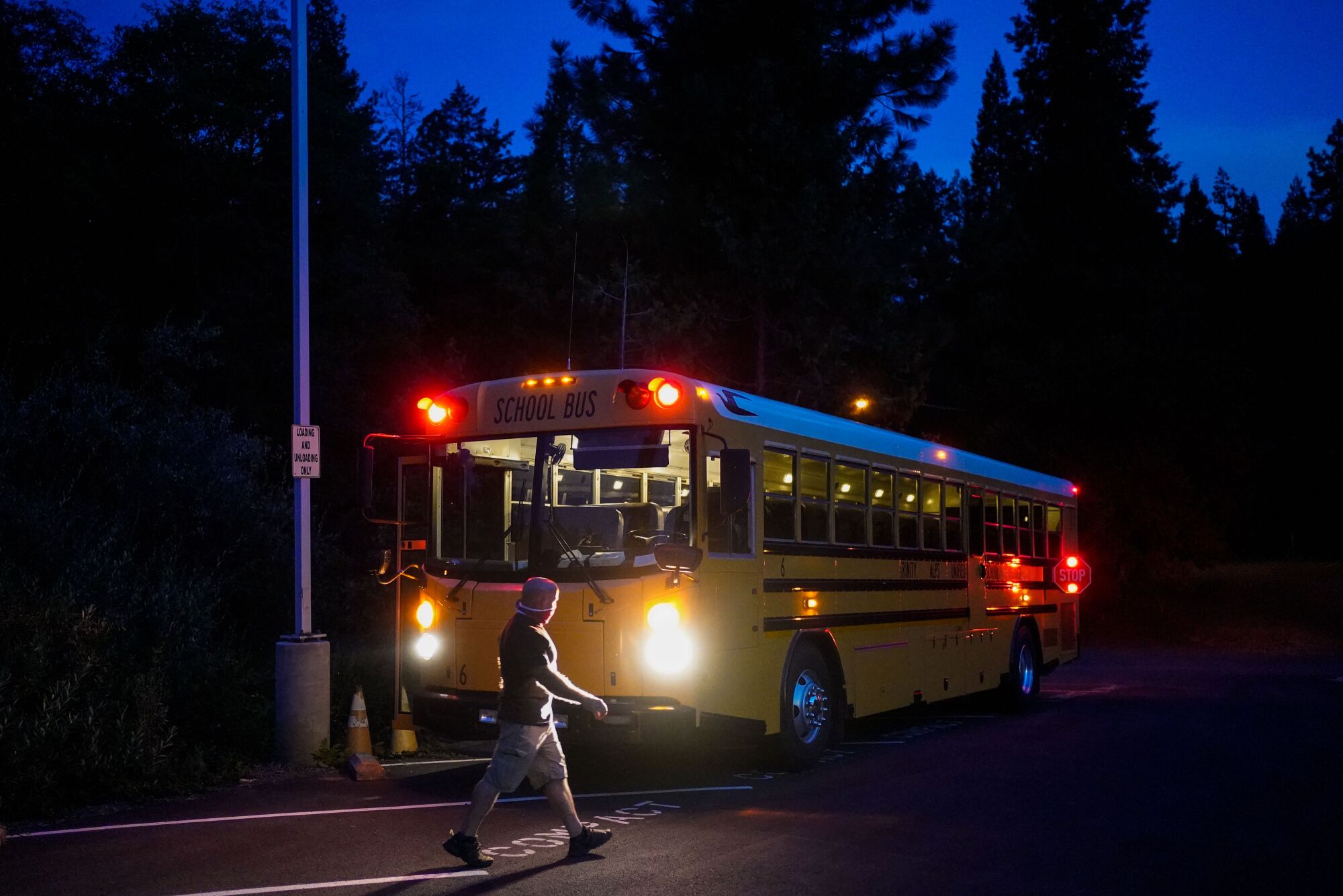 Carl Tereece inspects his bus before starting his route at Burnt Ranch Elementary in Burnt Ranch.